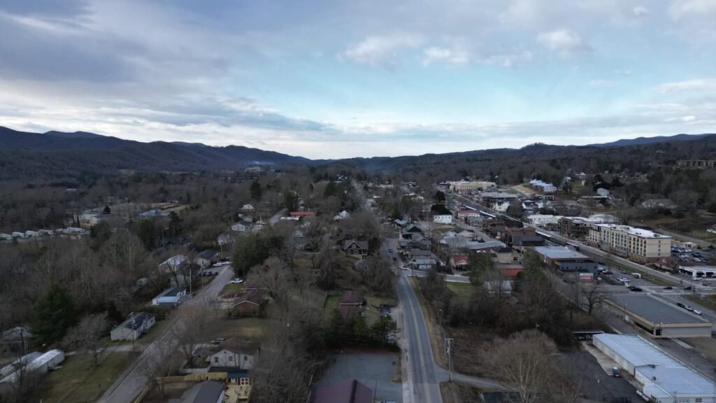 Aerial view of a small town in a valley surrounded by the Blue Ridge Mountains