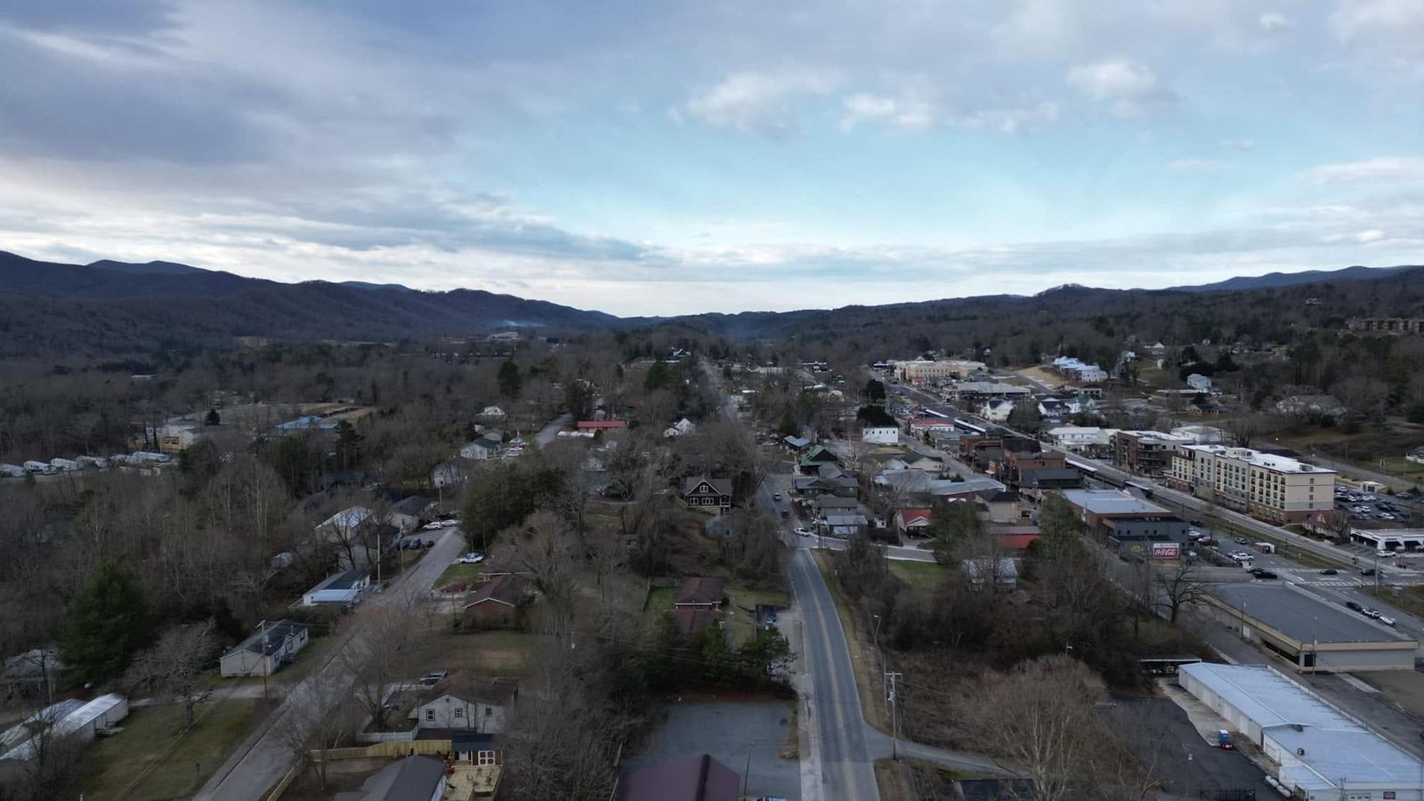 Aerial view of a small town in a valley surrounded by the Blue Ridge Mountains